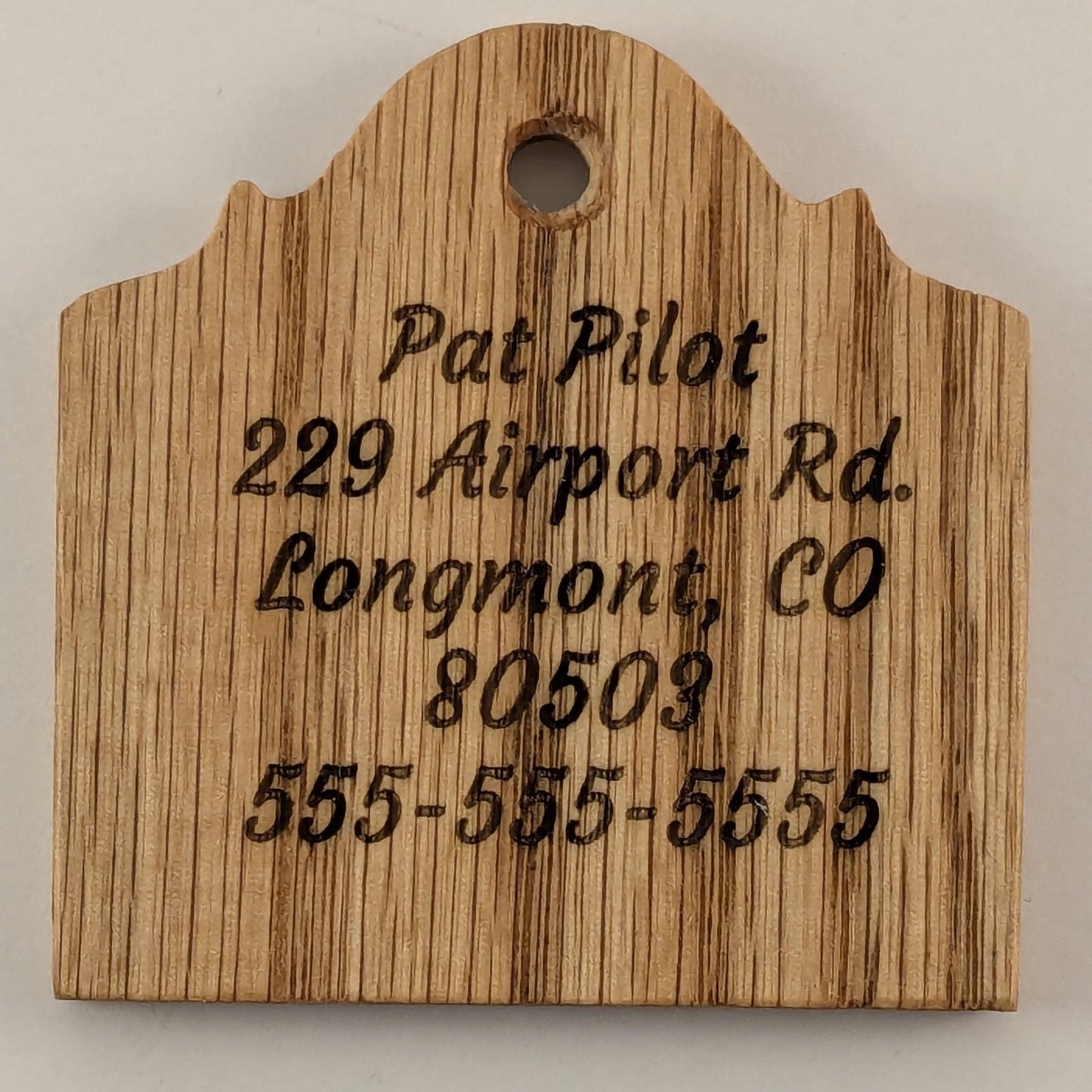 Wooden sign with engraved text on Oak