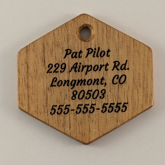 Wooden hexagonal tag with engraved text on Spanish Cedar